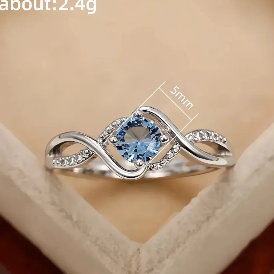 Elegant Women’s Geometric Twist Ring with Blue CZ Brass Wedding Band