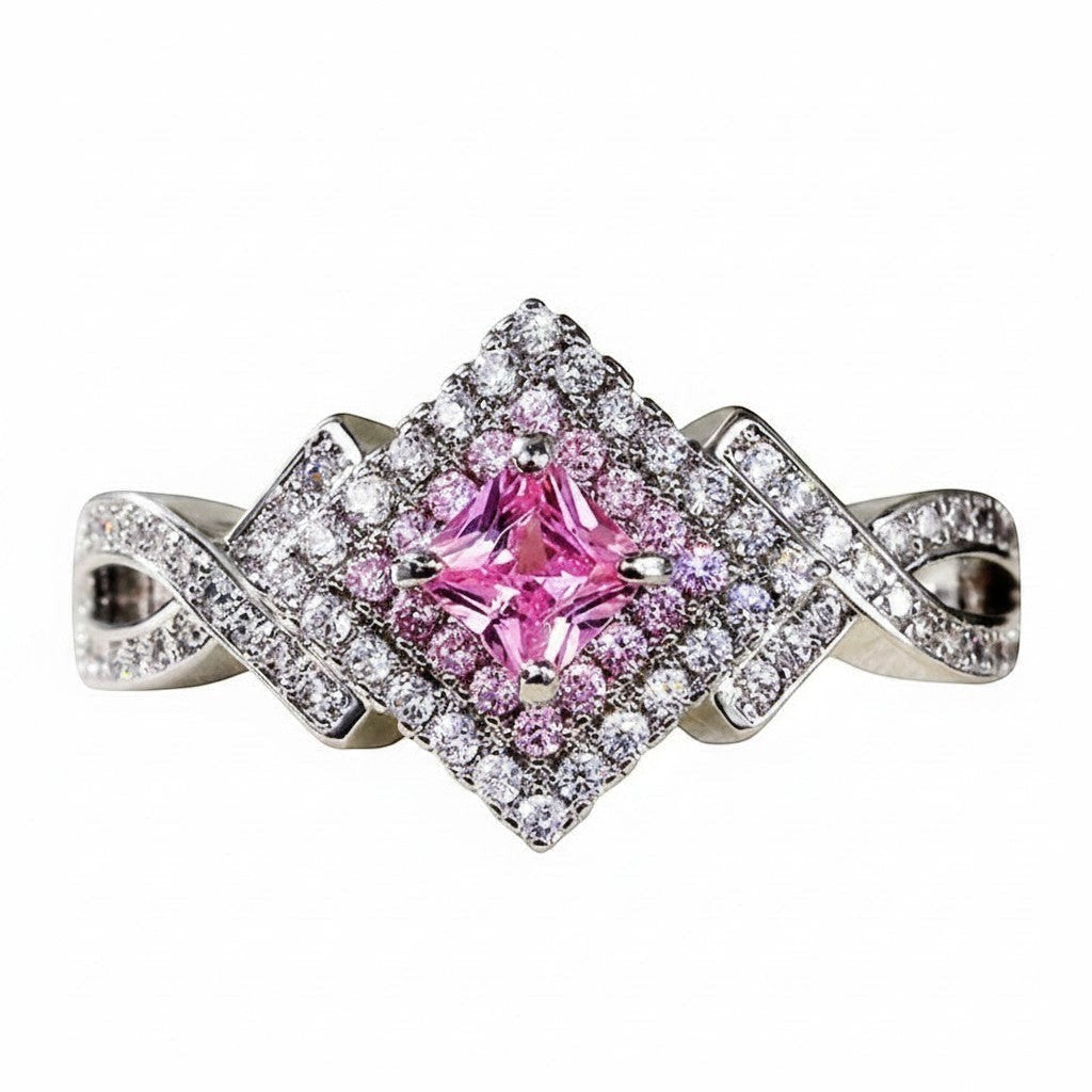 masiniaelara silver ring with a square pink center stone surrounded by small white and pink zircons. Twisted band.